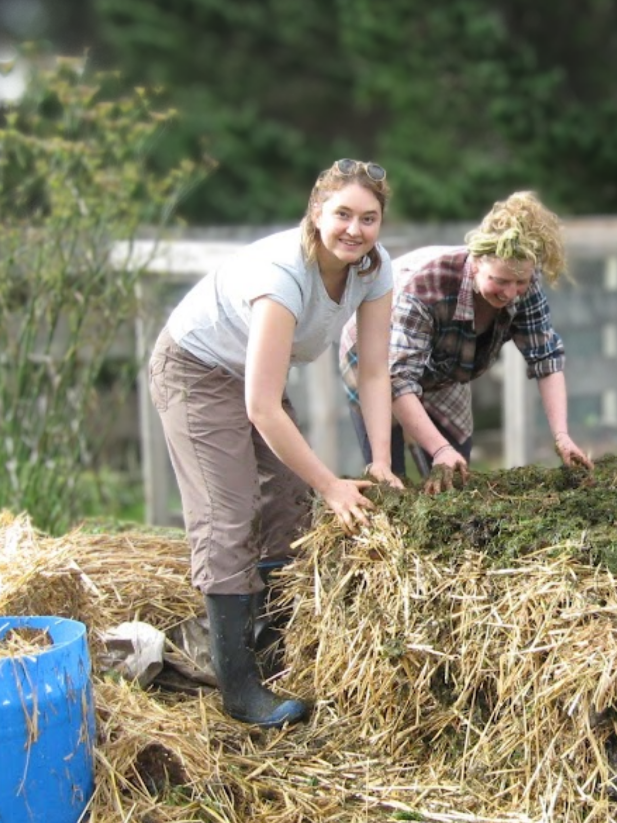 Emma Ellison standing outdoors in soft natural light, smiling.