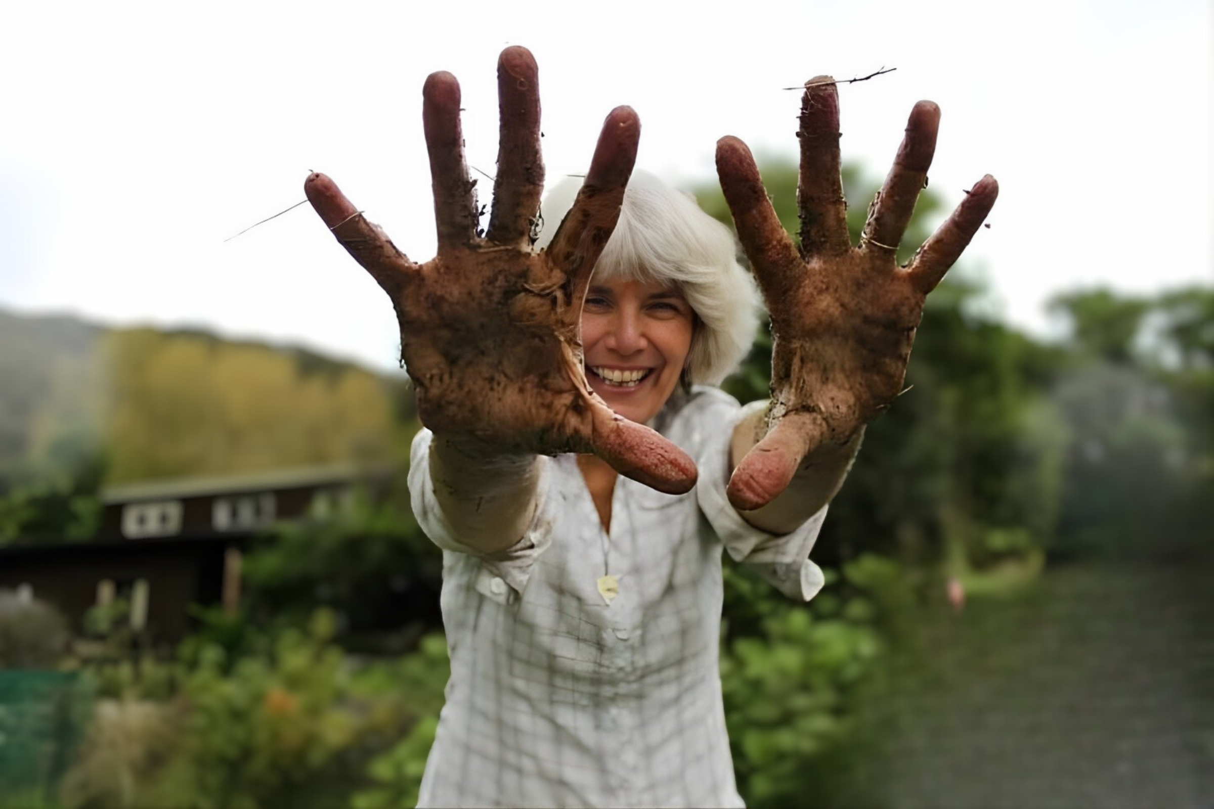 Woman with compost on her hands