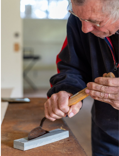 Man sharpening tools