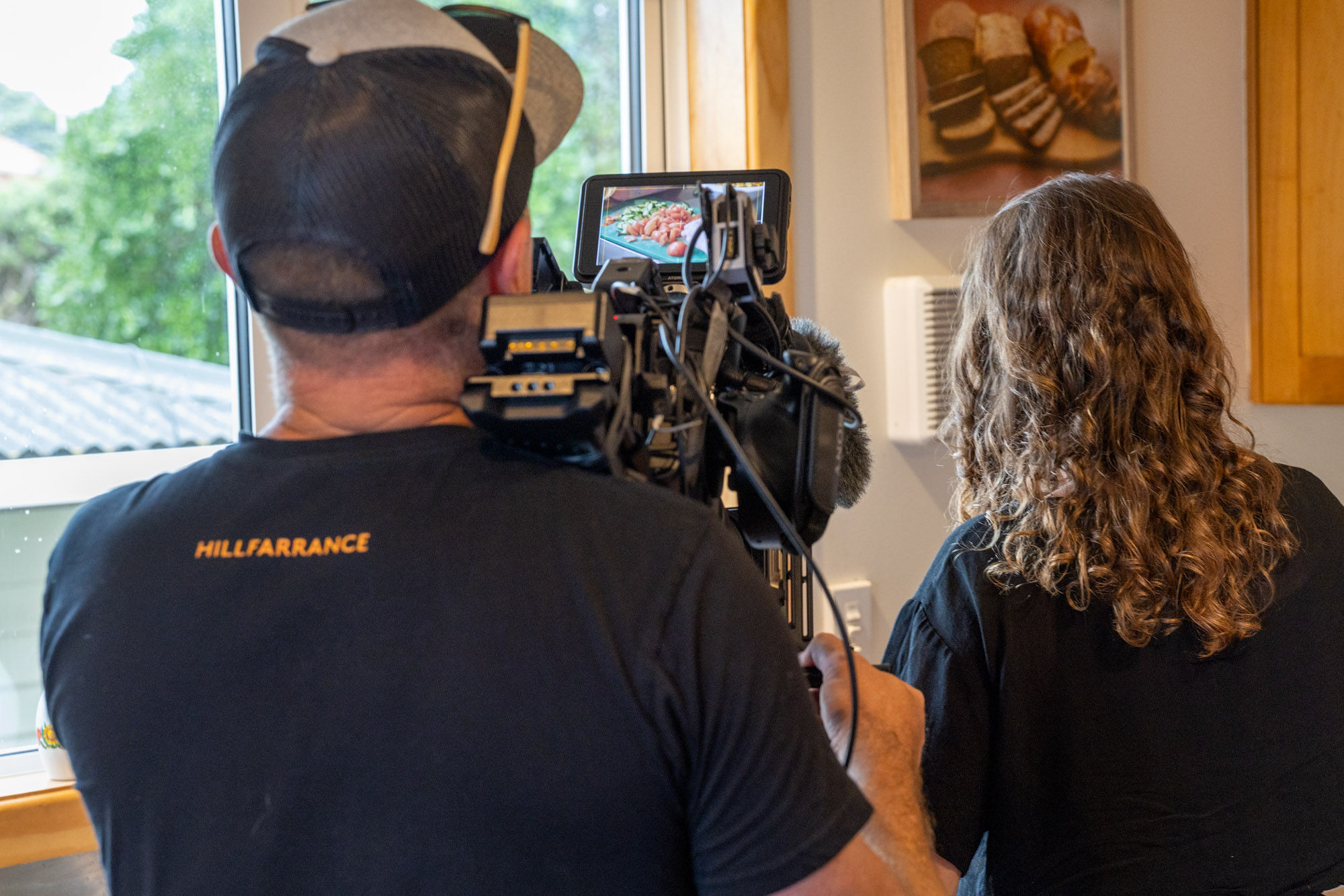 Woman being filmed preparing food