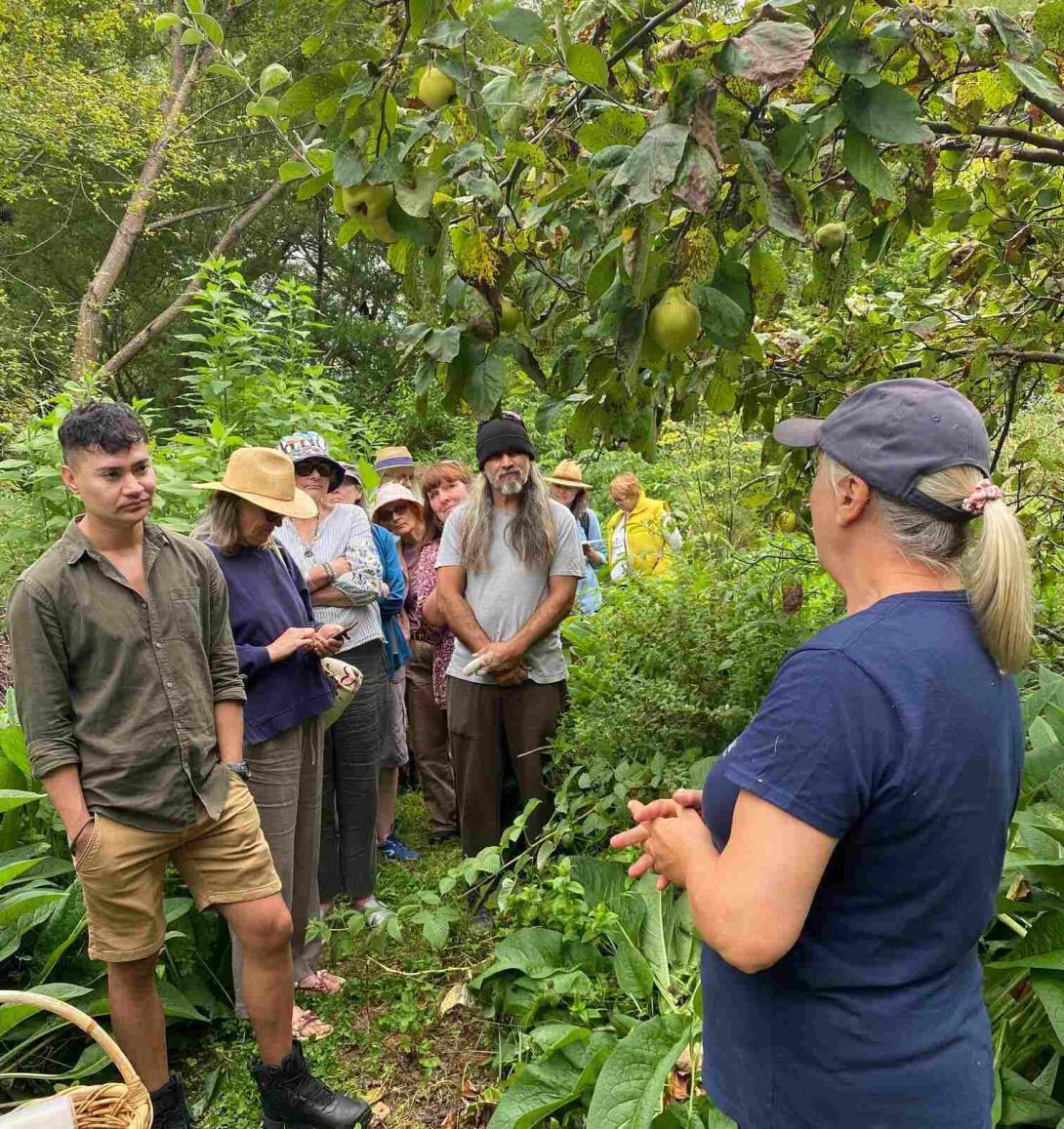 Deb Explaining the food forest to students