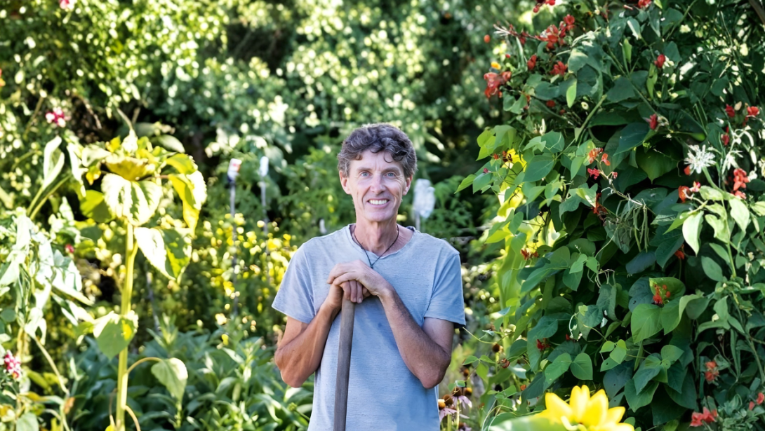 Man smiling standing in garden