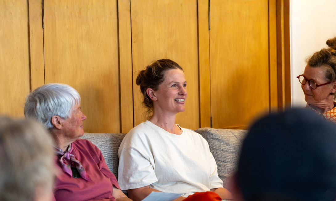 Woman smiling in group settings